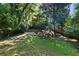 Expansive backyard offering a tranquil wooded setting at 2220 Edison Ave, Atlanta, GA 30305