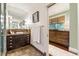 Bathroom featuring tiled floors and a vanity with dark wood cabinetry and a large mirror at 2220 Edison Ave, Atlanta, GA 30305