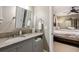 Bathroom vanity area features a sink with chrome fixtures and access to the primary bedroom at 2220 Edison Ave, Atlanta, GA 30305