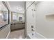 Bright bathroom with gray vanity, stone countertop, and a subway-tiled shower-tub combo at 2220 Edison Ave, Atlanta, GA 30305