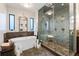 Bathroom showcasing a soaking tub, large shower, and vanity with dark wood cabinetry at 2220 Edison Ave, Atlanta, GA 30305