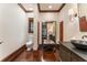 Well-lit powder room featuring dark wood accents and a view into the connecting space at 2220 Edison Ave, Atlanta, GA 30305