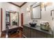 Elegant powder room with a vessel sink, dark wood cabinetry, and sophisticated decor at 2220 Edison Ave, Atlanta, GA 30305