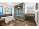 Elegant bathroom featuring a freestanding tub, glass-enclosed shower, and stylish fixtures for a luxurious experience at 2220 Edison Ave, Atlanta, GA 30305