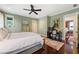 Bedroom with a queen-size bed and a quaint workstation; hardwood floors throughout the home at 2220 Edison Ave, Atlanta, GA 30305