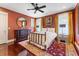 Spacious bedroom with a metal bed frame and red rug at 2220 Edison Ave, Atlanta, GA 30305