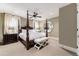 Main bedroom with a post bed, two ottomans, and a large mirror at 2220 Edison Ave, Atlanta, GA 30305