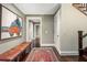 Hallway featuring hardwood floors, a bench, and staircase at 2220 Edison Ave, Atlanta, GA 30305