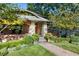 Brick home with stone accents, a welcoming front porch, and a lush lawn at 2220 Edison Ave, Atlanta, GA 30305