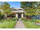 Brick house with stone accents, lush landscaping, and a brick pathway at 2220 Edison Ave, Atlanta, GA 30305