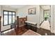 Upstairs hallway with hardwood floors, decorative runner on banister, and natural light at 2220 Edison Ave, Atlanta, GA 30305