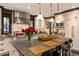 White kitchen with a center island with a stone top and seating and stainless steel appliances at 2220 Edison Ave, Atlanta, GA 30305