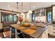 Modern kitchen with center island, stainless steel appliances and a built-in booth in seating area at 2220 Edison Ave, Atlanta, GA 30305