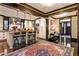 Bright kitchen featuring an island with bar seating, stainless steel appliances, and dark wood trim at 2220 Edison Ave, Atlanta, GA 30305