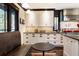 White cabinetry and dark countertops with stainless steel appliances and dark wood trim at 2220 Edison Ave, Atlanta, GA 30305