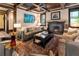 Living room with hardwood floors, coffered ceiling, and a fireplace at 2220 Edison Ave, Atlanta, GA 30305