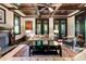 Elegant living room featuring a coffered ceiling, fireplace, and refined furnishings at 2220 Edison Ave, Atlanta, GA 30305