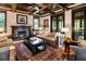 Living room with hardwood floors, coffered ceiling, and a fireplace at 2220 Edison Ave, Atlanta, GA 30305