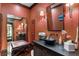 Stylish powder room, featuring a black vessel sink and coral walls at 2220 Edison Ave, Atlanta, GA 30305