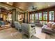 Relaxing screened porch with comfortable seating and a ceiling fan at 2220 Edison Ave, Atlanta, GA 30305