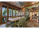 Spacious screened porch with dining area and seating, overlooking a wooded area at 2220 Edison Ave, Atlanta, GA 30305