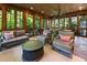 Relaxing sunroom featuring wood ceiling, stone floors, and floor to ceiling windows at 2220 Edison Ave, Atlanta, GA 30305