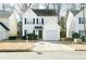 Two-story house with attached garage and manicured lawn at 30 Springbottom Dr, Lawrenceville, GA 30046