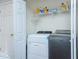 Laundry room with washer, dryer, and storage shelves at 30 Springbottom Dr, Lawrenceville, GA 30046