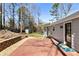 Deck and backyard with retaining wall and woodsy view at 3001 Scott Rd, Marietta, GA 30066