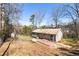 House with deck and spacious backyard, surrounded by mature trees at 3001 Scott Rd, Marietta, GA 30066