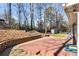 Deck and backyard with retaining wall and woodsy view at 3001 Scott Rd, Marietta, GA 30066