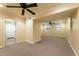 Large finished basement area with carpet and ceiling fans at 3001 Scott Rd, Marietta, GA 30066