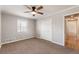 Spacious bedroom with neutral walls, ceiling fan and carpet flooring at 3001 Scott Rd, Marietta, GA 30066