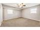 Spacious bedroom with neutral walls, ceiling fan and carpet flooring at 3001 Scott Rd, Marietta, GA 30066