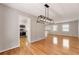 Bright dining room with hardwood floors and a modern light fixture at 3001 Scott Rd, Marietta, GA 30066