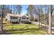 Ranch-style home with a large yard and mature trees at 3001 Scott Rd, Marietta, GA 30066