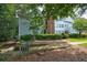 Side view of condo building with walkway and landscaping at 4321 Orchard Park Ct, Stone Mountain, GA 30083