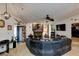 Living room with sectional sofa, fireplace, and ceiling fan at 4321 Orchard Park Ct, Stone Mountain, GA 30083