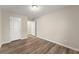 Cozy bedroom with wood-look floors and neutral walls, ready for personalization at 2595 Poplar Ln, Cumming, GA 30041