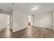 Spacious bedroom features modern wood-look floors and neutral walls with an ensuite bathroom at 2595 Poplar Ln, Cumming, GA 30041