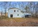 Exterior view of home with back deck and wooded lot at 3667 Humphries Hill Rd, Austell, GA 30106