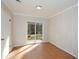 Finished basement with sliding glass door, neutral walls, and tile flooring at 3667 Humphries Hill Rd, Austell, GA 30106