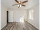Bedroom with hardwood floors, ceiling fan, and neutral color scheme at 3667 Humphries Hill Rd, Austell, GA 30106