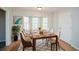 Elegant dining room filled with natural light and featuring a table with seating for eight at 3667 Humphries Hill Rd, Austell, GA 30106
