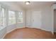 Sunny dining room with bay windows and terra cotta tile flooring at 3667 Humphries Hill Rd, Austell, GA 30106