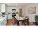 Well-appointed kitchen with white cabinetry, dining table, and stylish decor at 3667 Humphries Hill Rd, Austell, GA 30106