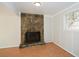 Living room showcasing stone fireplace, tile flooring, and natural light at 3667 Humphries Hill Rd, Austell, GA 30106