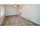 Spacious living room with hardwood floors, ceiling fan, and natural light at 3667 Humphries Hill Rd, Austell, GA 30106