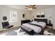 Stylishly decorated main bedroom featuring a bed, modern decor, and hardwood floors at 3667 Humphries Hill Rd, Austell, GA 30106