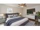Cozy main bedroom with a bed, dresser, TV, and plush carpeting at 3667 Humphries Hill Rd, Austell, GA 30106